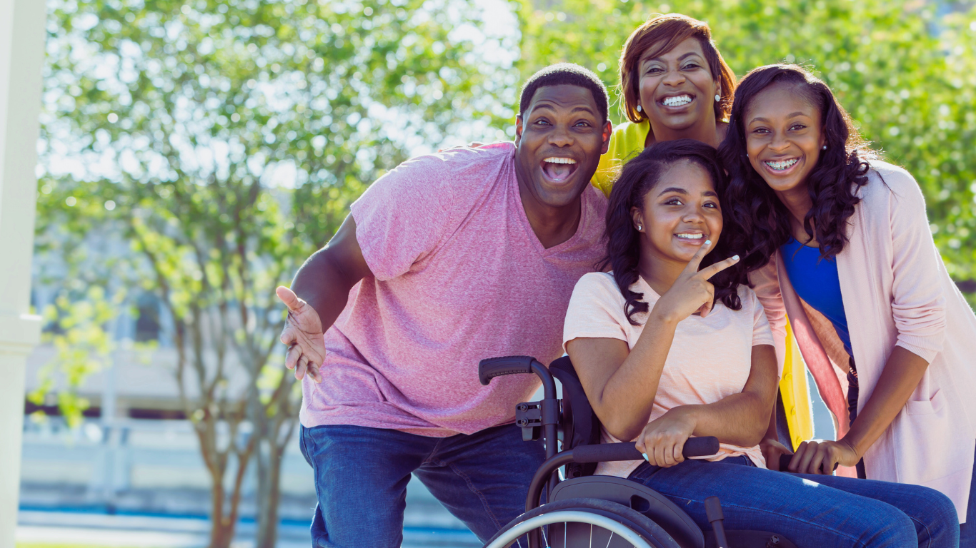 A family with a young woman in a wheelchair